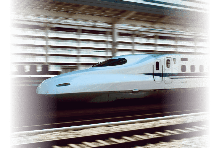 A high speed rail bullet train traveling with motion lines blurred.